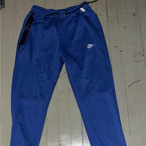 Blue Nike athletic sweatpants